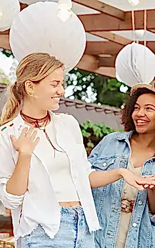 how to plan a bachelorette party friends looking at engagement ring featured